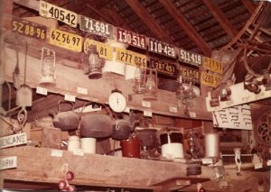 This snapshot of the interior of the barn is undated but was likely taken in the 1960s. The collection of license plates dating back to 1915, along with many antiques and Uncle Everett's arrowhead display, was a familiar sight to the farmstand's many customers.